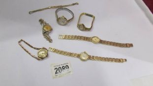 Six ladies wrist watches including Smith's Empire and other vintage, all in yellow metal.