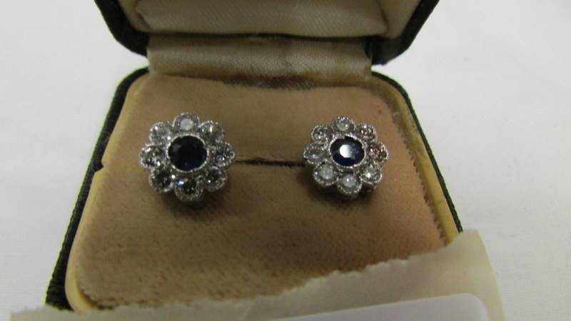 A pair of 18ct white gold diamond and sapphire earrings. - Image 2 of 2