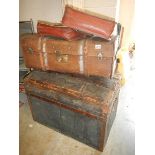 Two cabin trunks and three satchels.