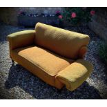 A 19th century? Victorian 2 seater drop arm sofa in ochre fabric.