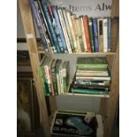 3 shelves of golf related books.