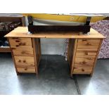 A solid pine double pedestal desk