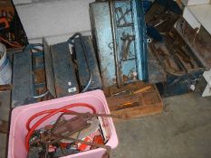 4 metal tool boxes and a large quantity of tools.