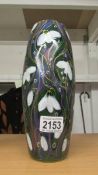 An Anita Harris art pottery skittle vase hand painted with snowdrops, 10" tall.