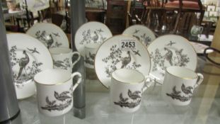 A set of 6 Royal Worcester coffee cups and saucers.