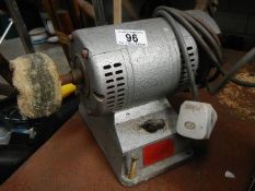 An old bench polisher and a grinding machine.