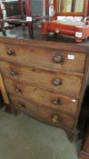 A four drawer mahogany chest.