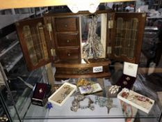 A jewelery box & contents including necklaces,