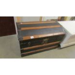 A dome top cabin trunk in good condition.