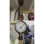 A Victorian mahogany barometer.