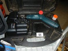 A small boxed Black and Decker drill.