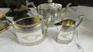 A three piece silver plate tea set.