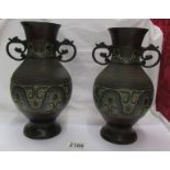 A pair of bronze cloissonne vases.