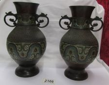 A pair of bronze cloissonne vases.