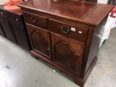 A dark wood stained 2 drawer cupboard with folding top, 96 x 48 x 87 cm high.