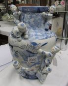 A blue and white oriental vase.