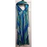 Blue and Green halter neck evening gown in a lightweight fabric (maybe silk) with rosette waist