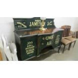 An Edwardian mahogany sideboard painted and sign written for Jameson's.