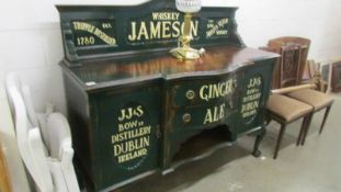 An Edwardian mahogany sideboard painted and sign written for Jameson's.