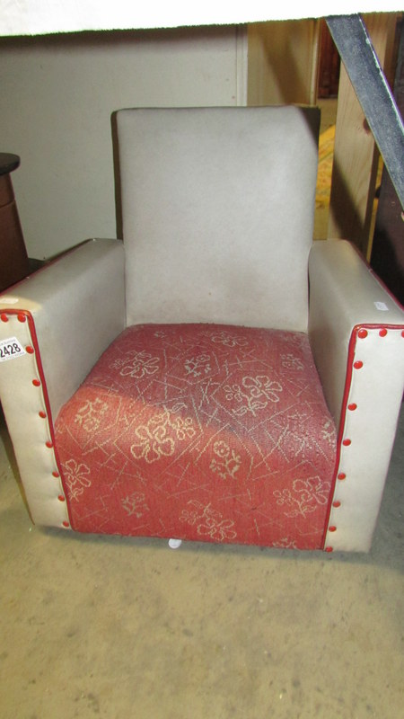 A circa 1930's child's arm chair.