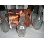 Three glass decanters and a boxed set of 4 champagne flutes.