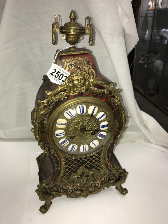 A superb quality buelle mantel clock. in good condition.