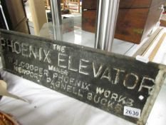 A cast iron sign for Pheonix Elevator, W J Cooper, Pheonix Works, 52 x 16 cm,