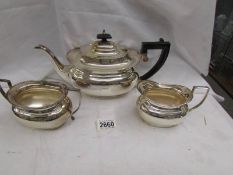 A Three piece silver plate tea set.