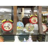 Five vintage novelty clocks including Mickey Mouse, Noddy, Sooty and Sweep etc.