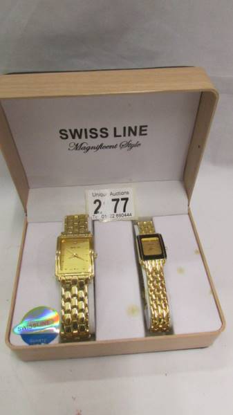A boxed pair of ladies and gent's Swiss Line wrist watches.