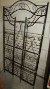 A black painted collapsible/folding wire shelving unit. (Collect only).