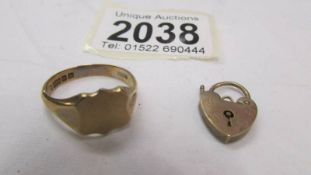 A 9ct gold signet ring and a 9ct gold padlock, 5.7 grams.