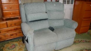 A two seater electric reclining sofa. (Collect only).