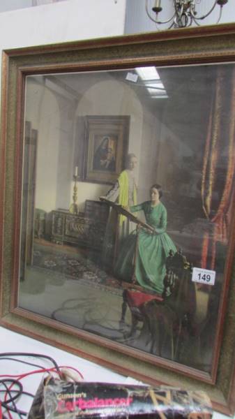 A framed and glazed print of a Victorian drawing room.