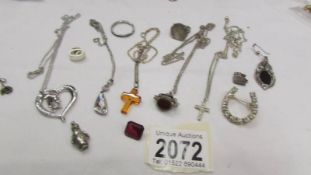 A mixed lot of jewellery including pendants (some silver), silver ring etc.