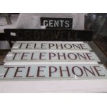 Three 'Telephone' signs, a Cromwell sign and a gents sign.