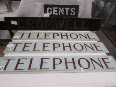 Three 'Telephone' signs, a Cromwell sign and a gents sign.
