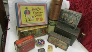 A mixed lot of old tins including commemorative and a John Bull printing set box.