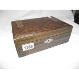 An oak box of miscellaneous including pocket knives, silver topped pot,