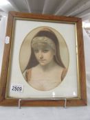 A framed and glazed Victorian print in and oak frame, in good condition.