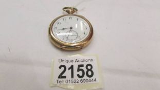 A gold plated pocket watch in working order.