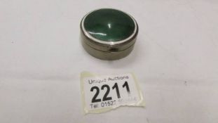 An enamel top snuff box in good condition.