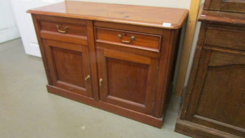 A mahogany 2 door, 2 drawer sideboard.