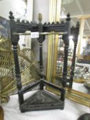 A cast iron corner stick stand,