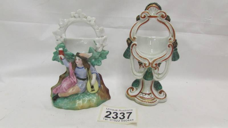 Two ceramic pocket watch stands.