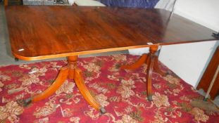 A Strachan double pedestal tri leg table with brass feet. (Collect only).