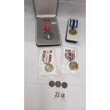 A U S Bronze star in case, a NATO ISAF medal in case,