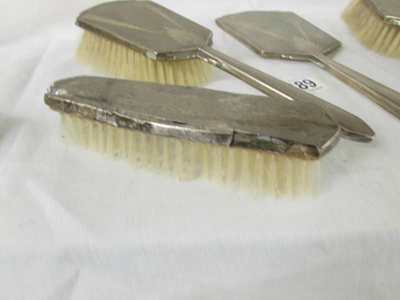 A silver backed vanity set comprising hand mirror, 2 hair brushes and 2 other brushes, - Image 6 of 6