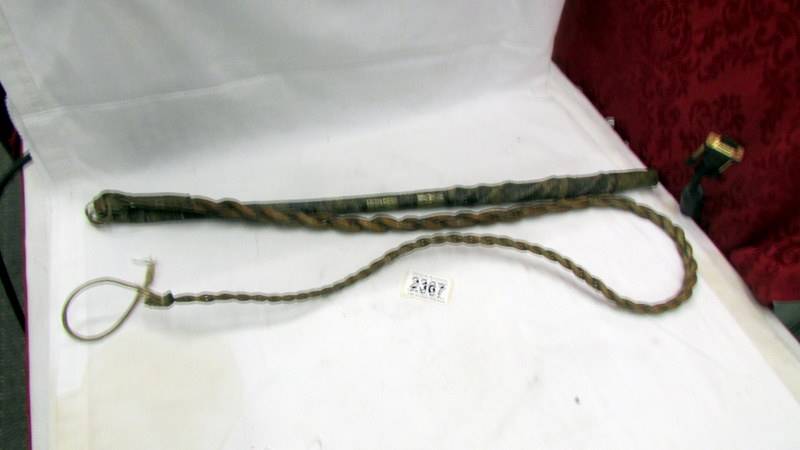 A very early plaited leather horse whip.