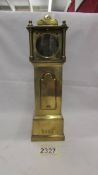 A heavy brass pocket watch stand in the form of a Grandfather clock